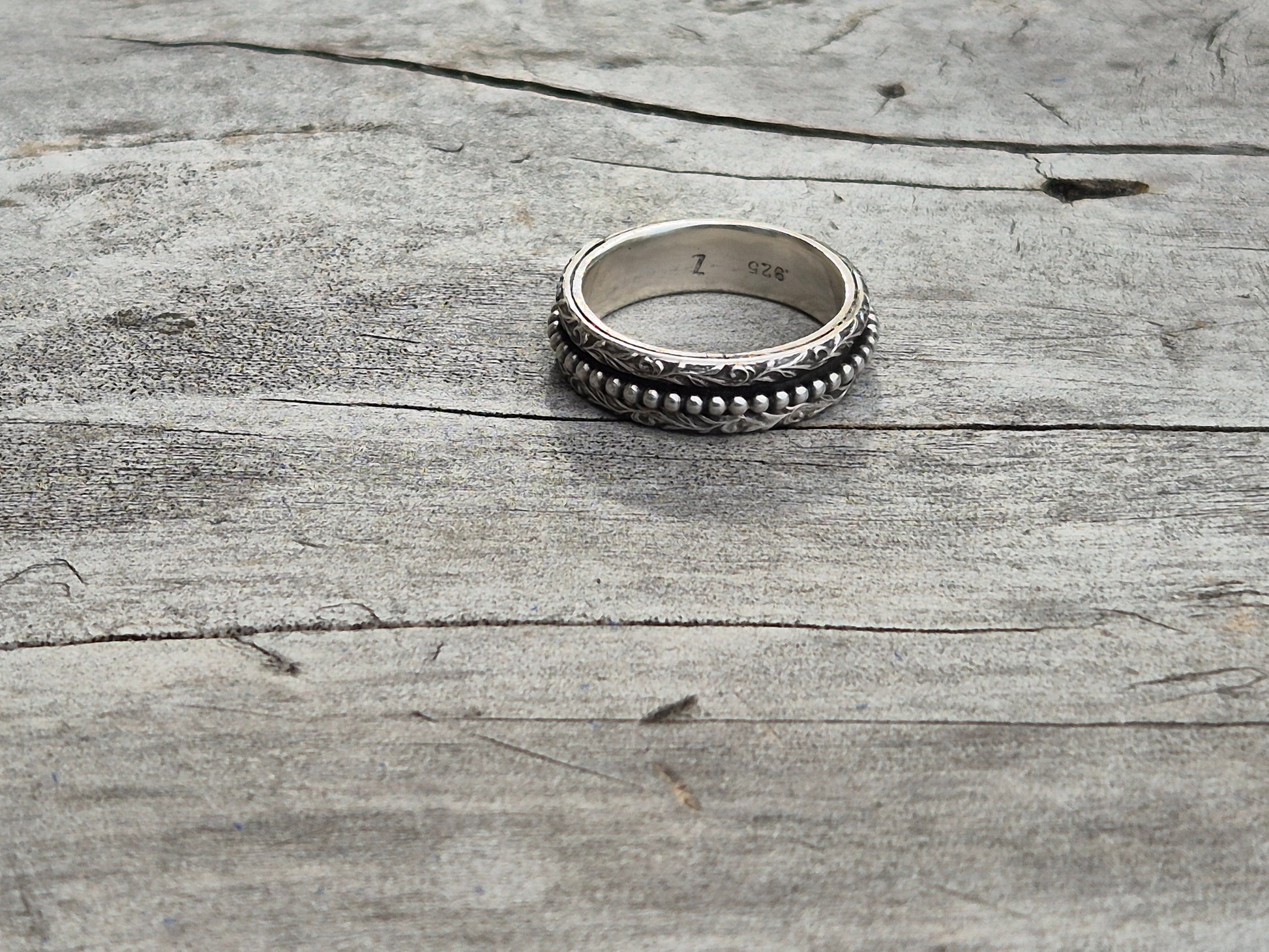 Spinner ring on wooden surface