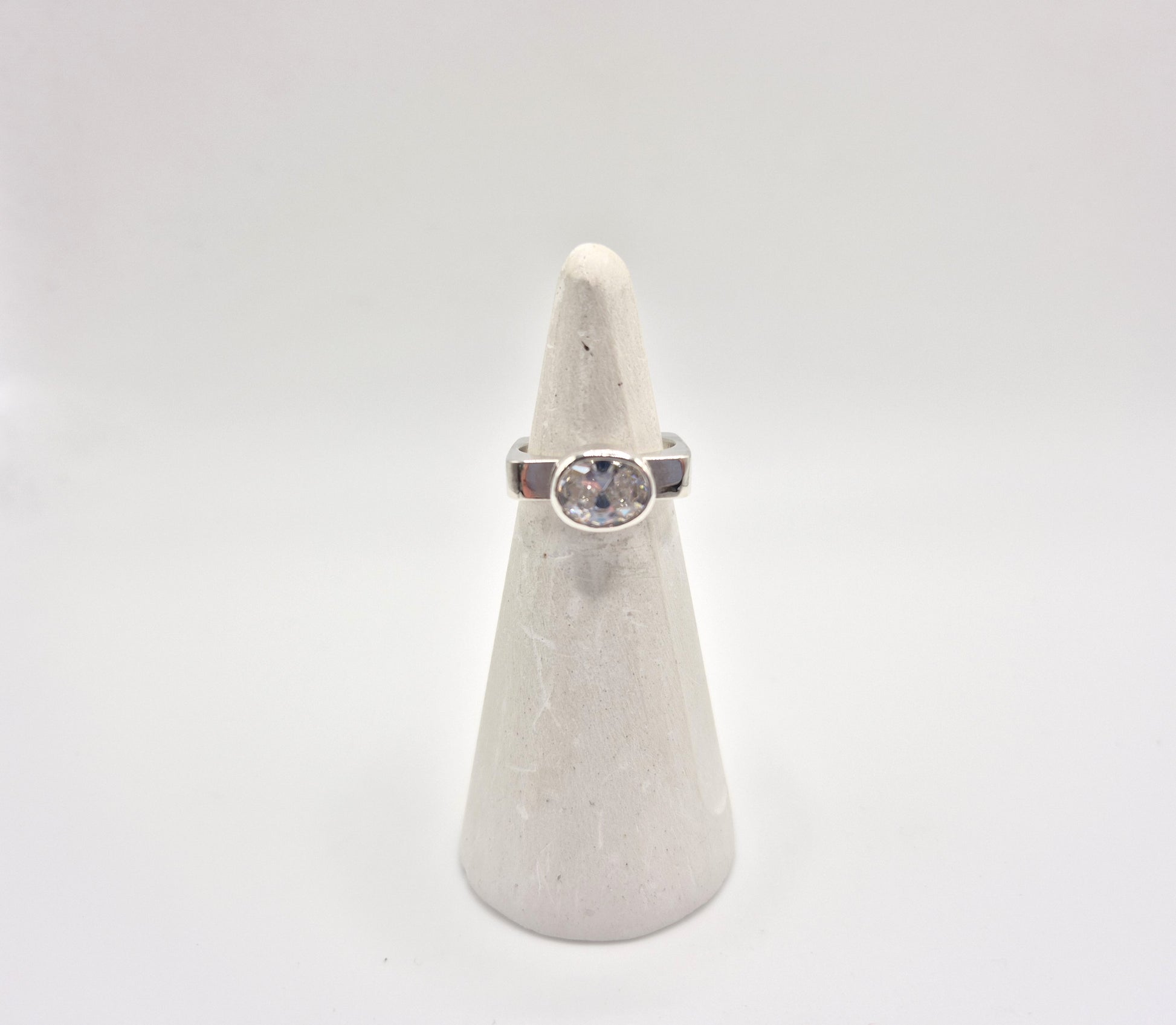  Cubic zirconia ring on white ring cone