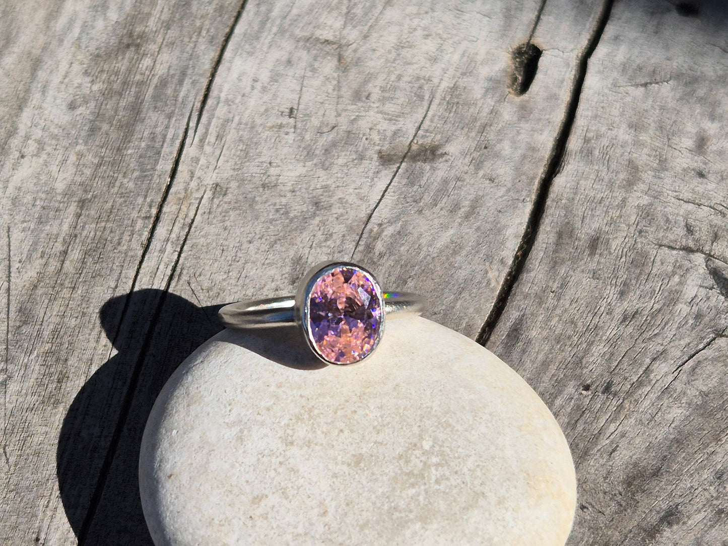slim pink cz ring on a pebble